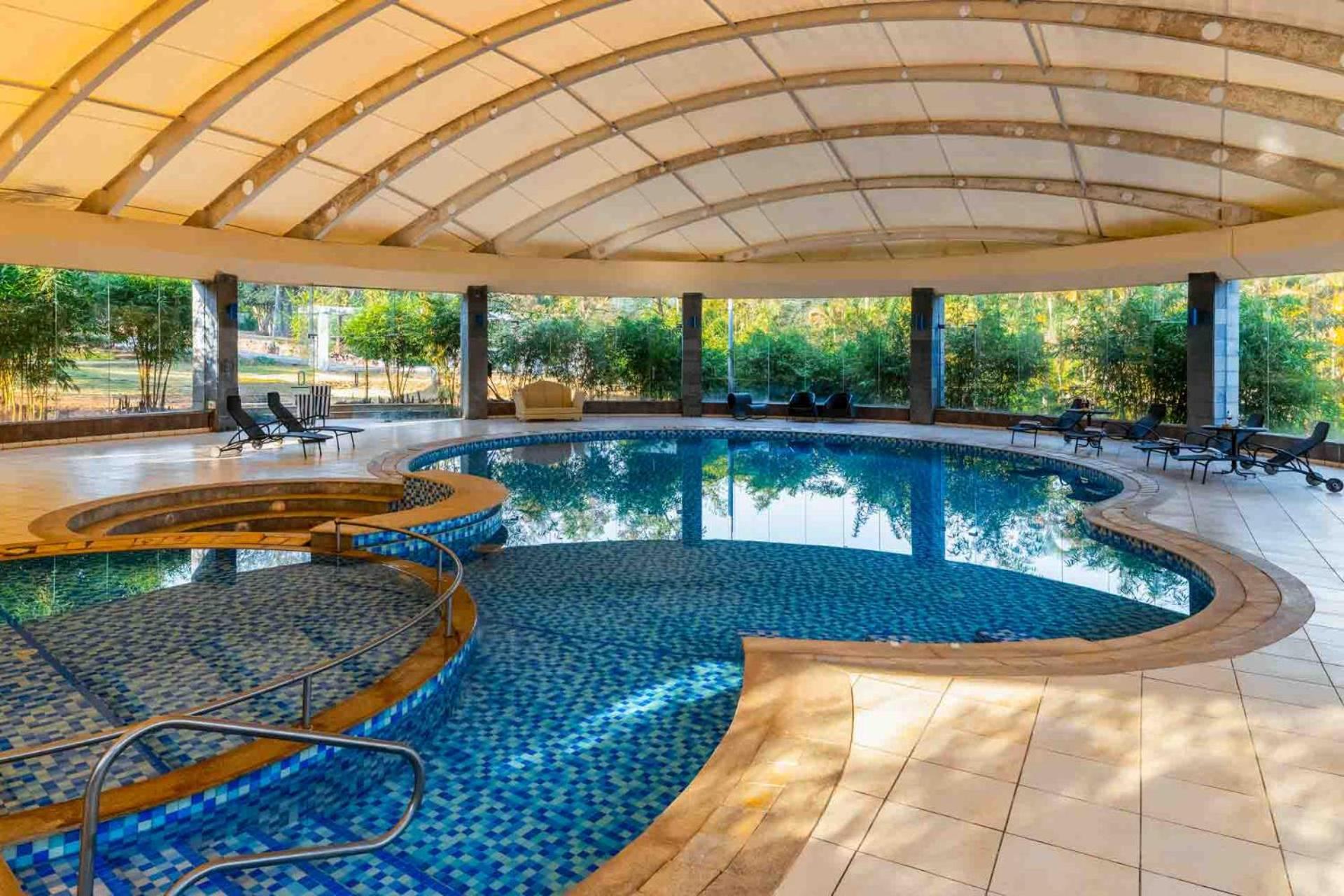 Stayvista's Emerald Acres: Luxury Retreat With Heated Pool & Scenic Views